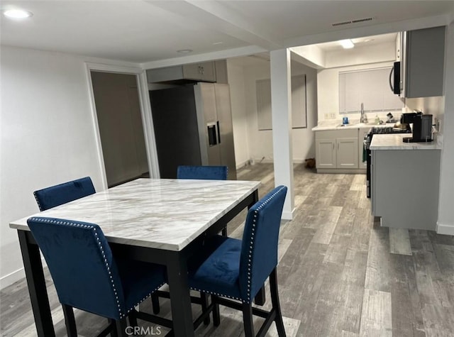 dining space featuring light hardwood / wood-style floors