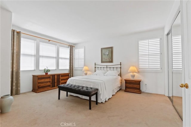 carpeted bedroom featuring a closet