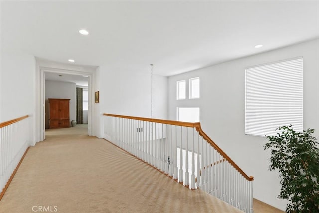 hallway featuring recessed lighting and carpet floors