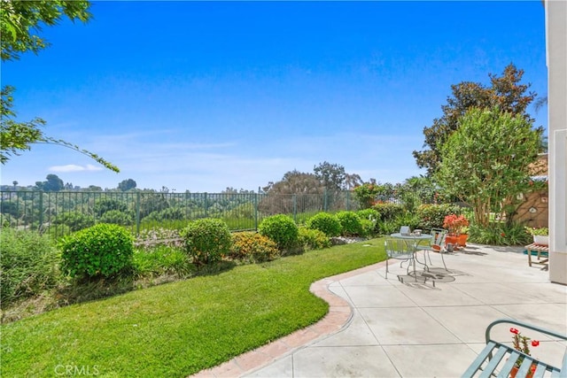 view of yard featuring a patio and fence