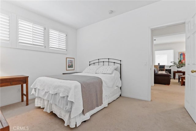 bedroom featuring baseboards and carpet floors