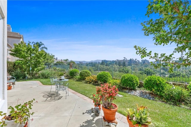 view of patio / terrace featuring fence