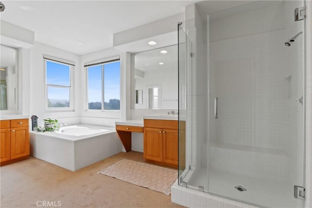 bathroom with a stall shower and vanity