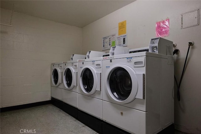 3601 W Hidden Ln Unit 121, Rolling Hills Estates, CA 90274 - community laundry with separate washer and dryer, concrete block wall, and tile patterned floors