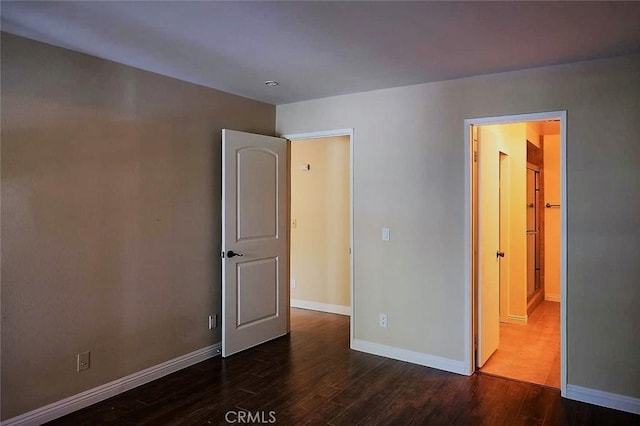 3601 W Hidden Ln Unit 121, Rolling Hills Estates, CA 90274 - unfurnished bedroom with dark wood finished floors and connected bathroom