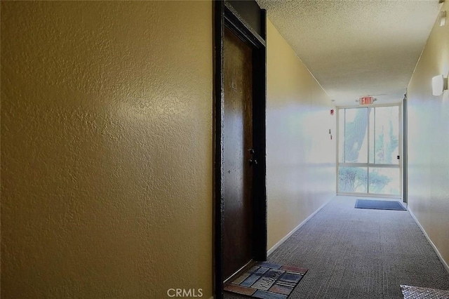 3601 W Hidden Ln Unit 121, Rolling Hills Estates, CA 90274 - hallway with carpet, a textured ceiling, and a textured wall