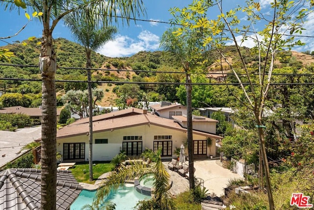 back of property featuring a patio area