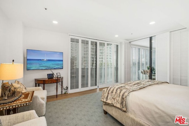 bedroom with hardwood / wood-style flooring