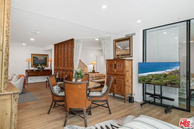 dining space featuring light hardwood / wood-style flooring