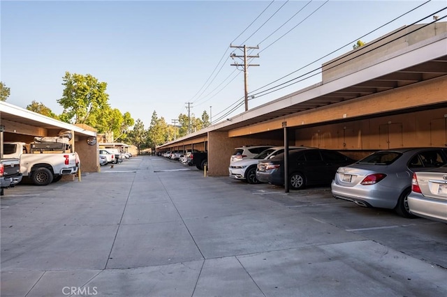 view of vehicle parking featuring a carport