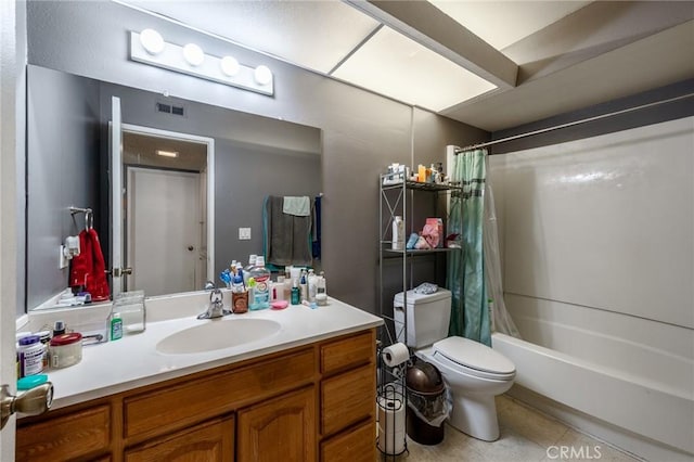 full bathroom with shower / tub combo, vanity, tile patterned floors, and toilet