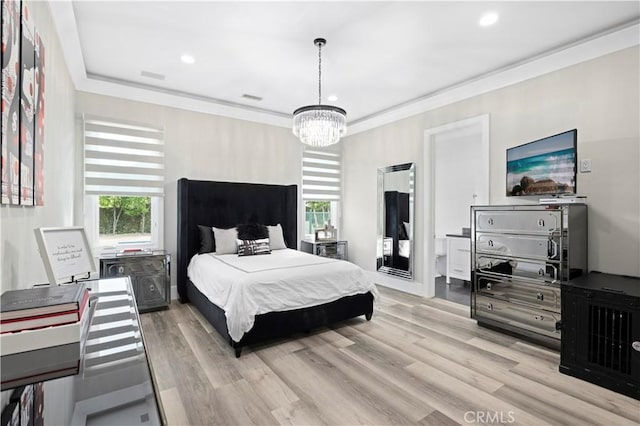 bedroom featuring recessed lighting, light wood-type flooring, and an inviting chandelier