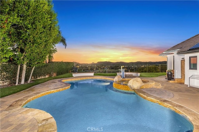 view of swimming pool with a fenced in pool, fence, and a patio area