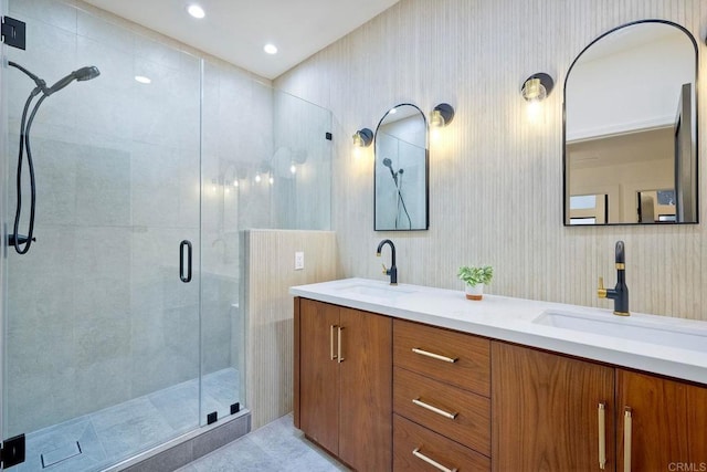 bathroom with walk in shower and vanity