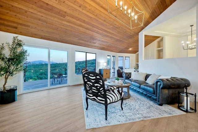 living room with lofted ceiling, wood ceiling, an inviting chandelier, light hardwood / wood-style floors, and a mountain view