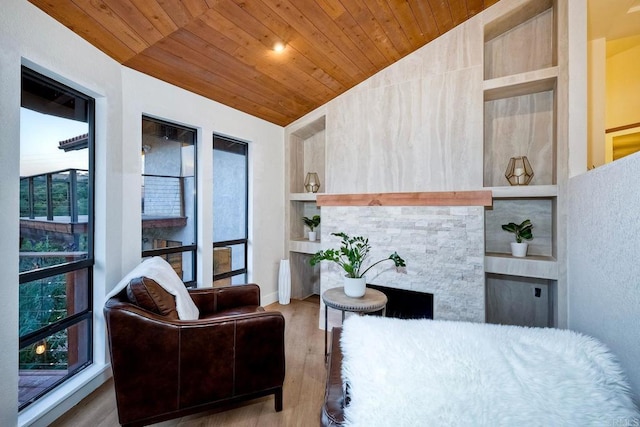 bedroom featuring lofted ceiling, wood ceiling, and wood-type flooring