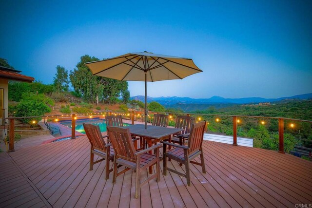 deck at dusk with a mountain view