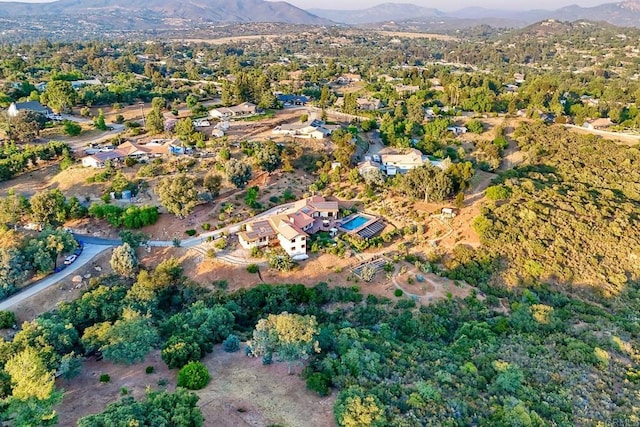 birds eye view of property with a mountain view