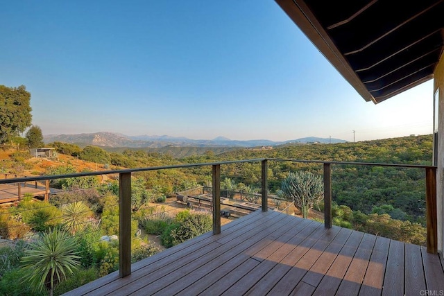 wooden terrace featuring a mountain view