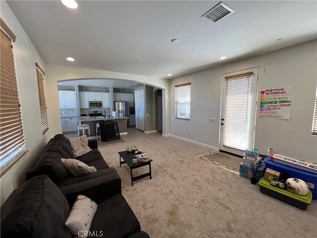 living room featuring light carpet