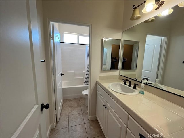 full bathroom with tile patterned floors, vanity, toilet, and shower / bathing tub combination