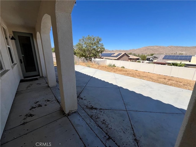 view of patio / terrace with a mountain view