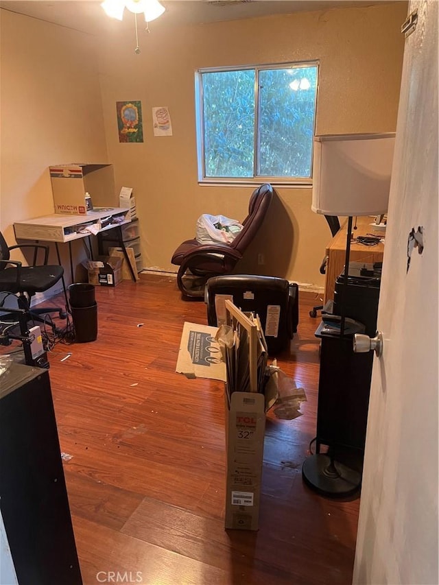 office space with wood-type flooring