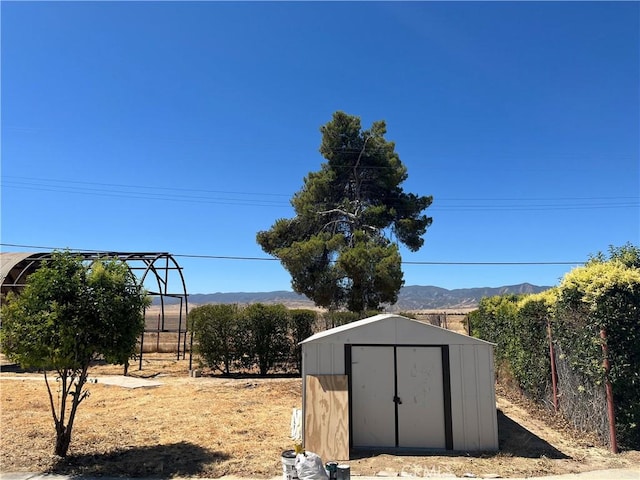 view of outbuilding featuring a mountain view