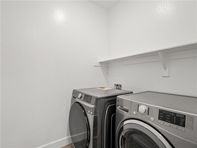 washroom featuring washer and clothes dryer