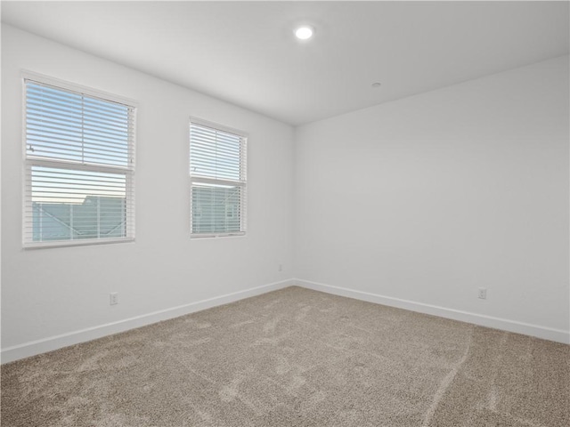 unfurnished room featuring carpet flooring