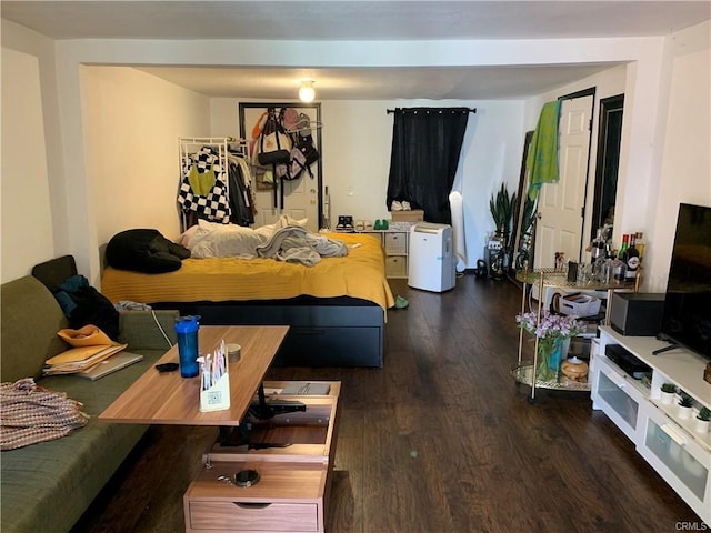 bedroom featuring dark hardwood / wood-style flooring