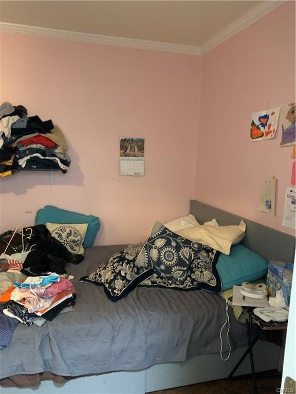 bedroom featuring ornamental molding