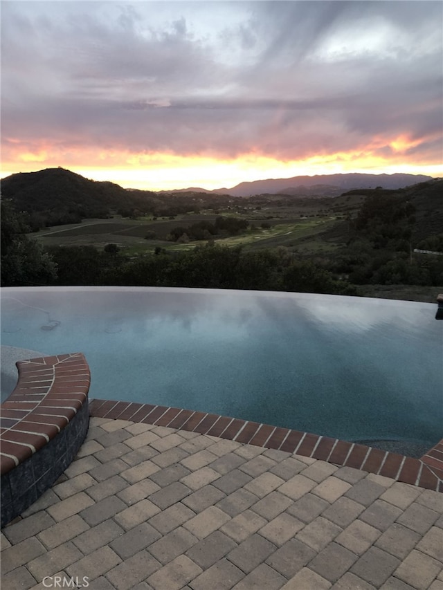 property view of water featuring a mountain view