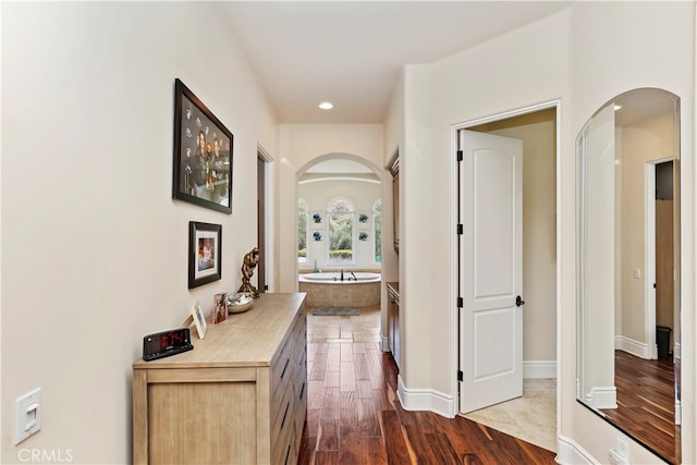 corridor featuring dark hardwood / wood-style flooring