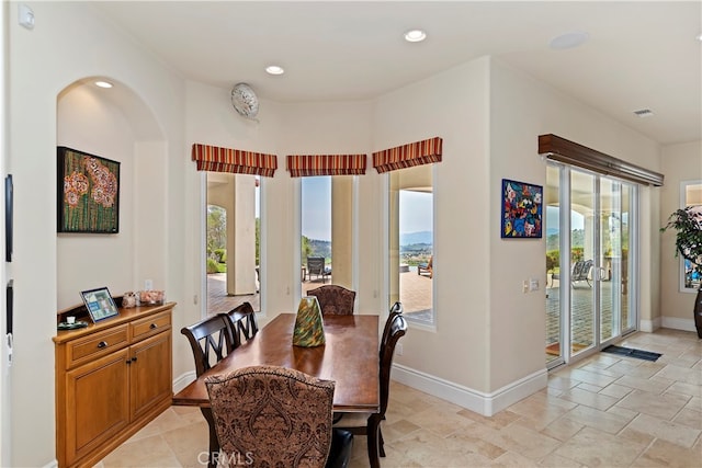 tiled dining space with a mountain view