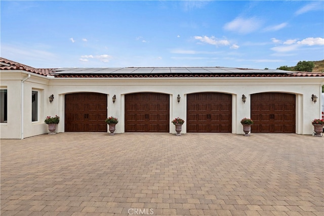 garage featuring solar panels