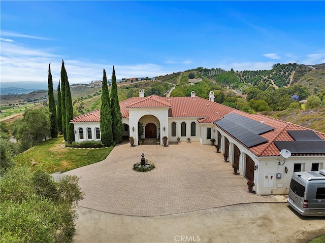 mediterranean / spanish home with solar panels