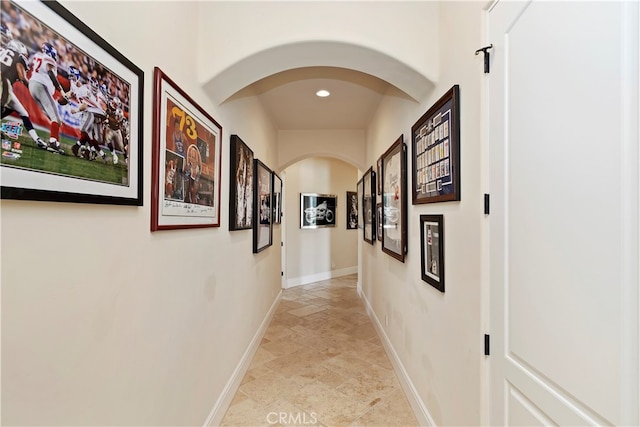 hallway with tile patterned floors