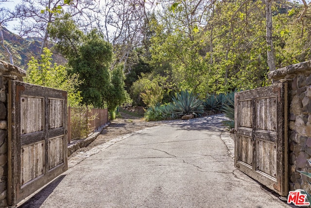 view of gate with a mountain view