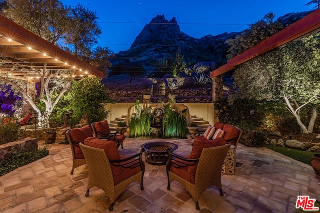 view of patio / terrace featuring an outdoor living space with a fire pit