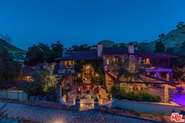 rear view of house with a mountain view