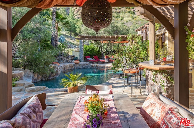 view of patio with an outdoor bar