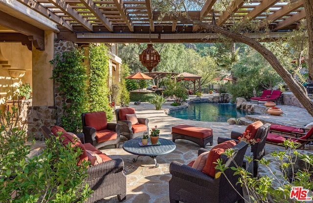 view of patio with pool water feature, an outdoor living space, and a pergola