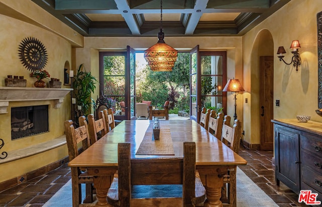 dining space with beam ceiling, ornamental molding, and coffered ceiling