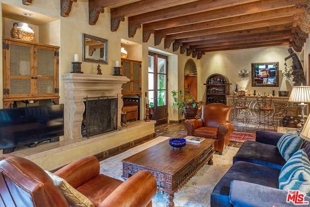 living room featuring beam ceiling