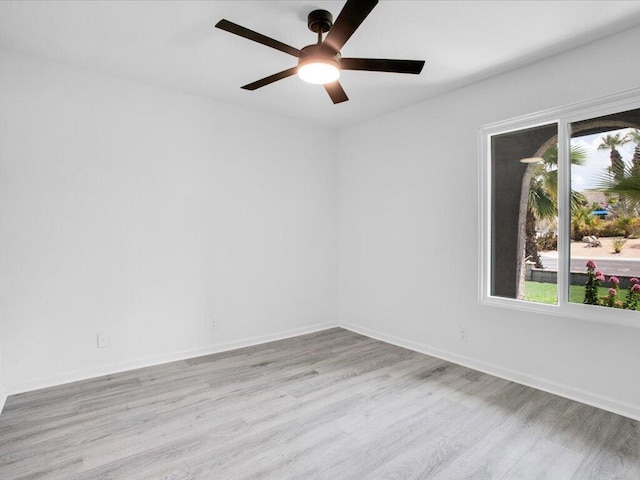 unfurnished room with light wood-type flooring and ceiling fan