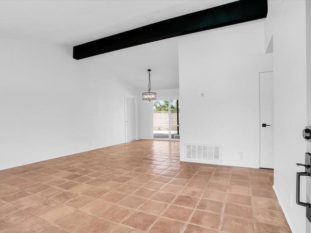 empty room featuring beam ceiling and a notable chandelier