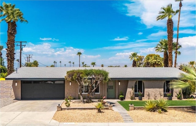 ranch-style home with a garage