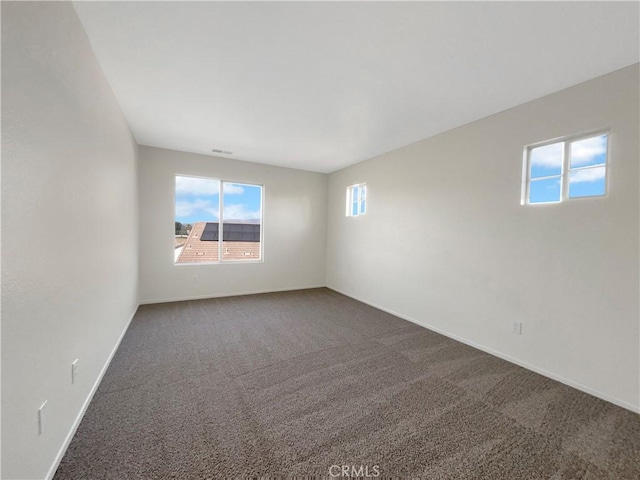 unfurnished room with carpet