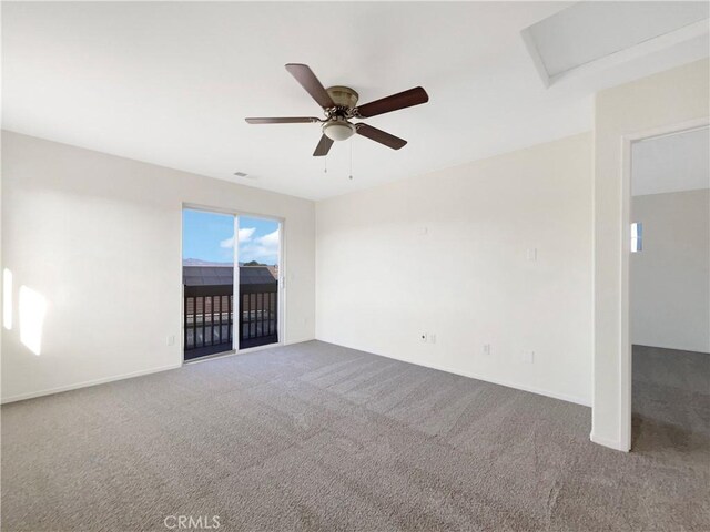 spare room with carpet floors and ceiling fan